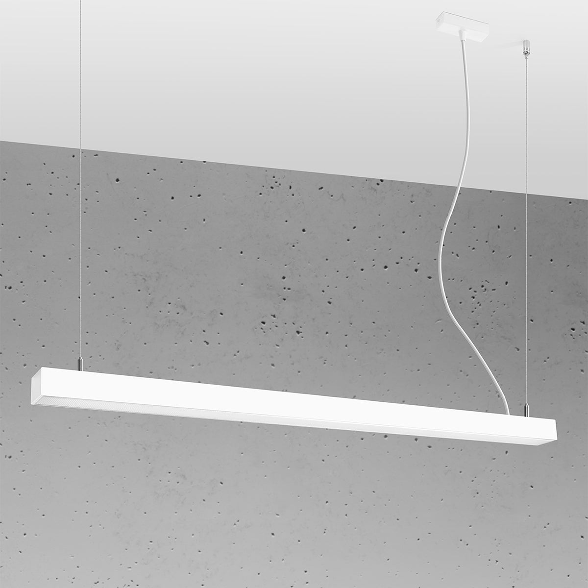 Mise en ambiance du luminaire suspendu devant un mur en béton brut