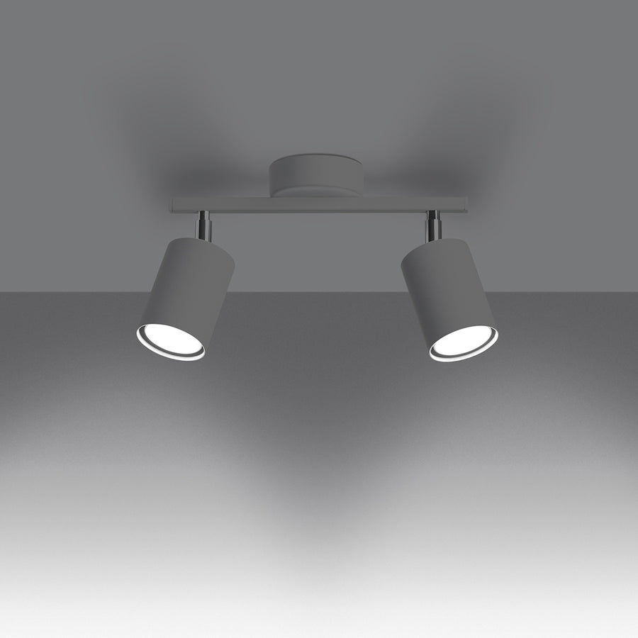 Plafonnier blanc allumé, installé au plafond, éclairant une pièce sombre.