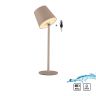 Lampe beige sur pied avec télécommande noire, vue de trois quarts.