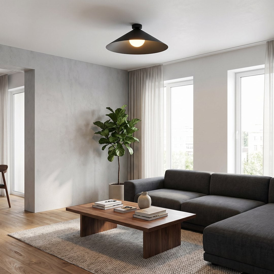 Mise en ambiance dans un salon contemporain avec canapé gris et plante verte