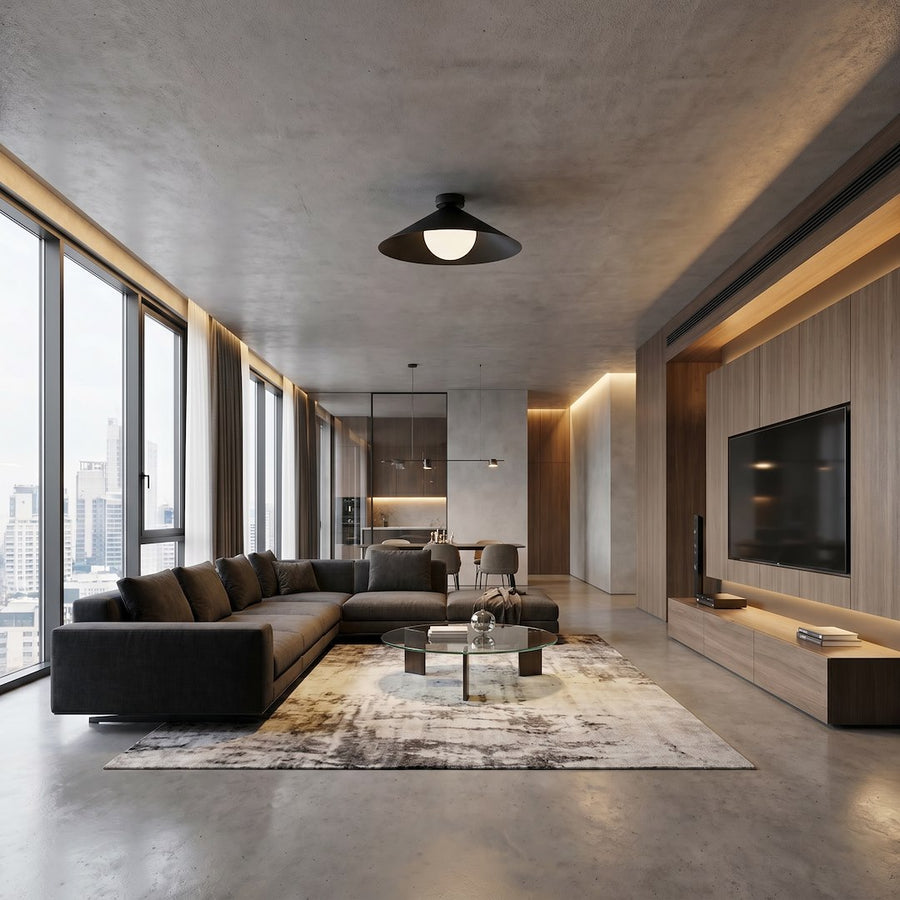 Vue large d'un séjour contemporain avec le plafonnier noir fixé au plafond béton.