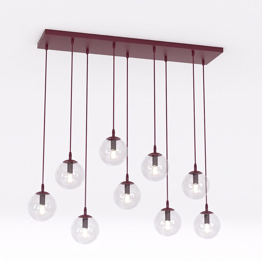 Vue de face sur fond blanc du luminaire et ses neuf globes suspendus.