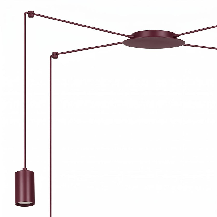 Détail du pavillon central et d'une lumière cylindrique bordeaux avec son câble.
