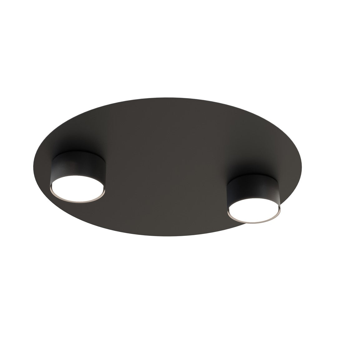 Vue de face du plafonnier rond noir et de ses deux spots cylindriques allumés