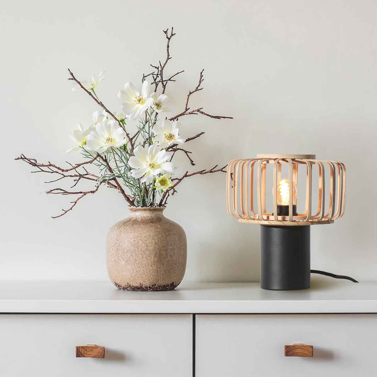 Small black Bloeba 4143ZW table lamp with a natural bamboo lampshade