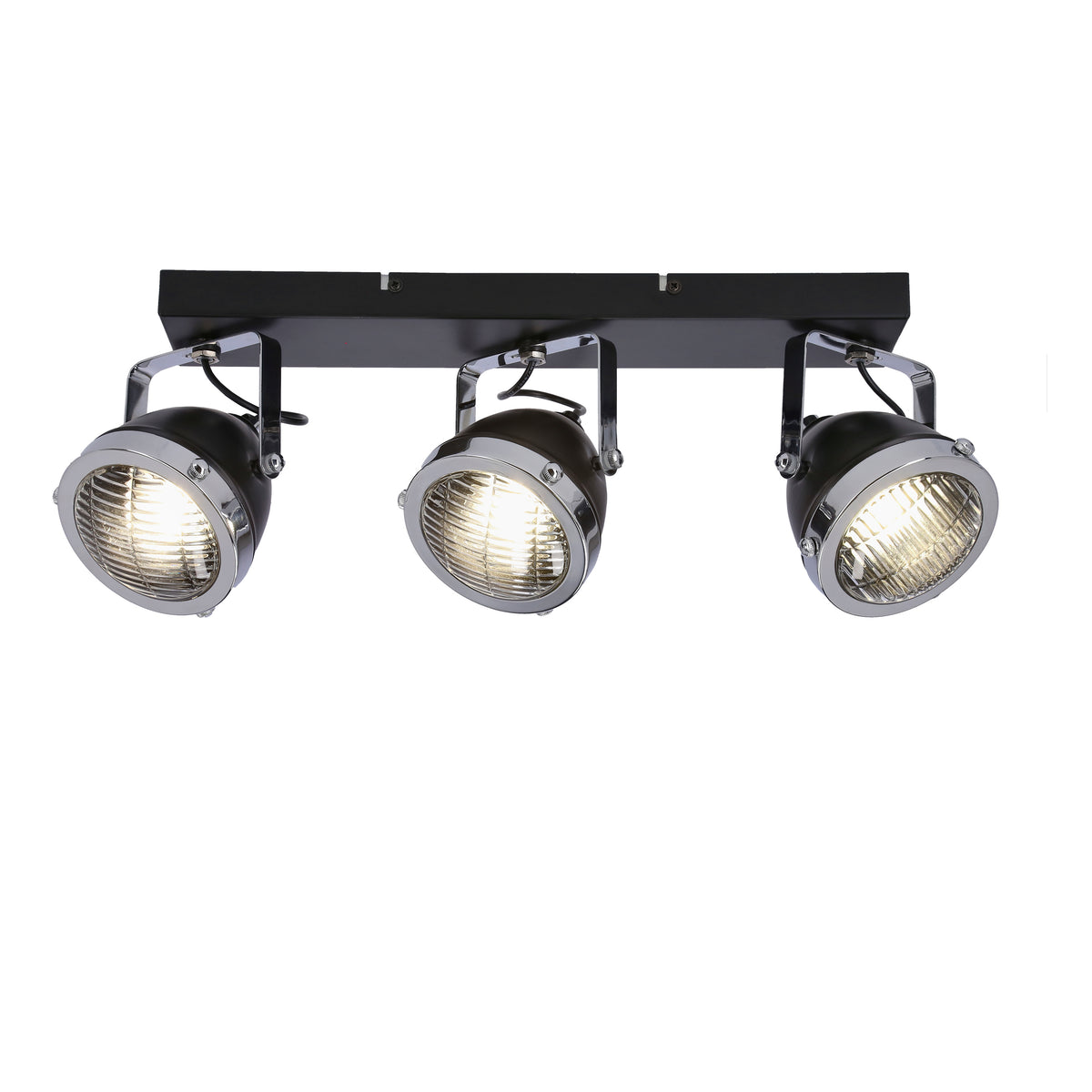 Luminaire allumé, lumière chaude traversant les grilles des trois spots