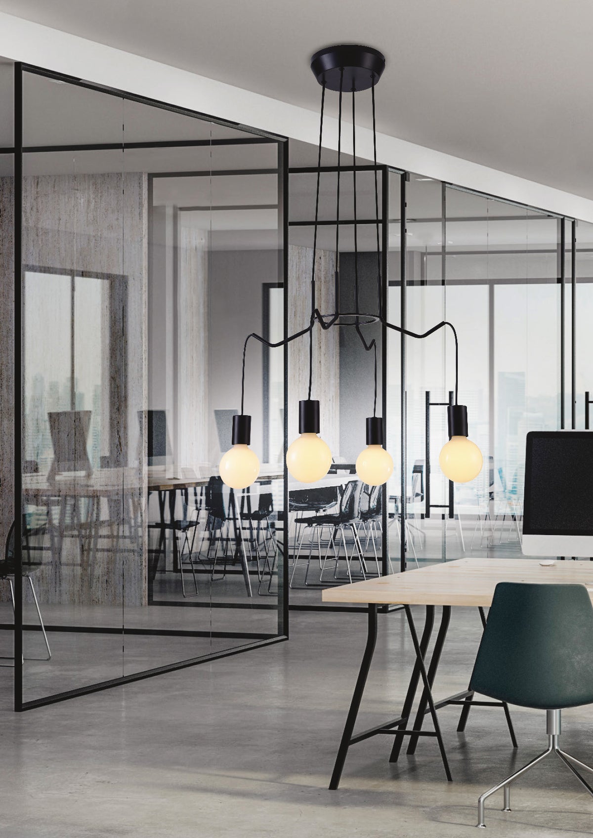 Suspension installée au-dessus d'une table de bureau dans un espace vitré contemporain.