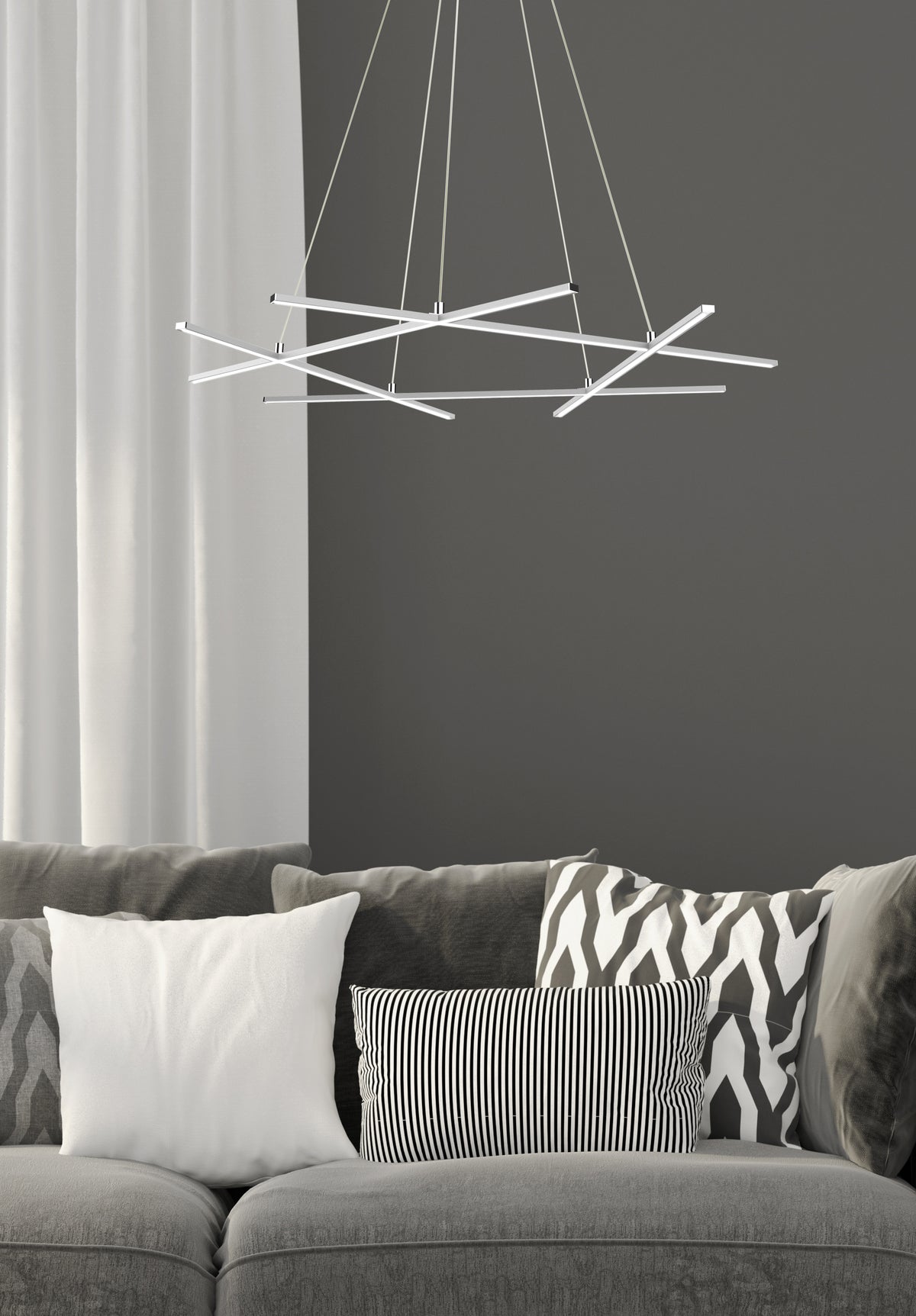Mise en ambiance au-dessus d'un canapé gris devant un mur anthracite