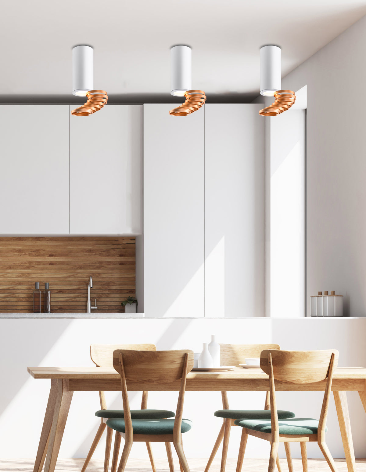 Mise en ambiance cuisine avec trois suspensions au-dessus d'une table en bois