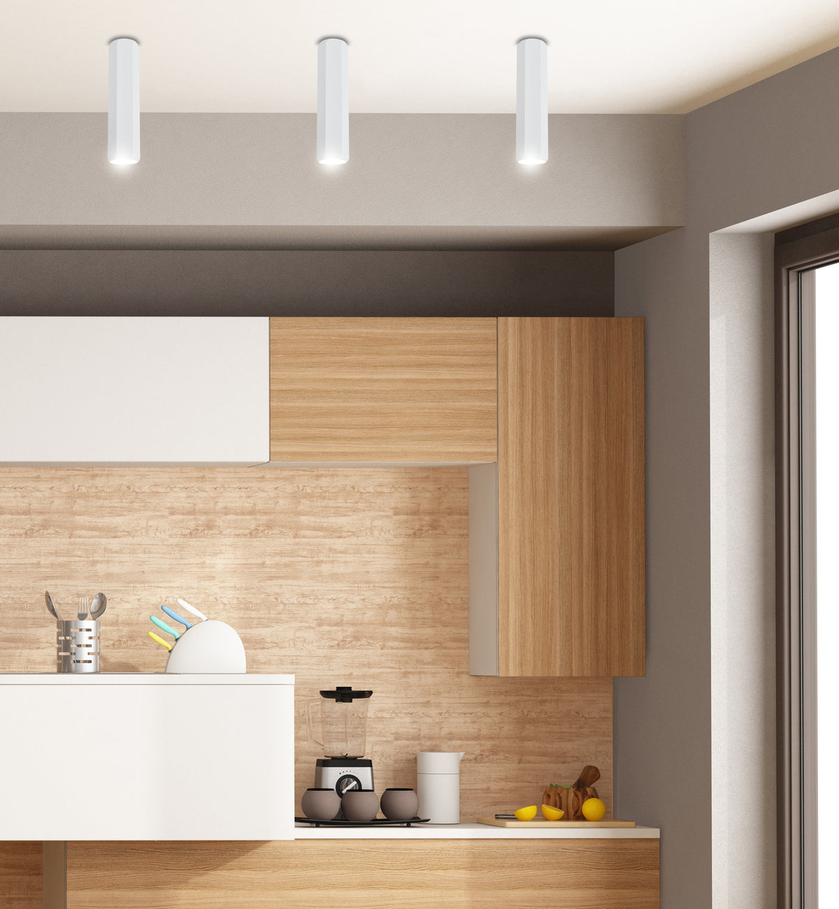 Mise en ambiance cuisine avec trois spots cylindriques blancs fixés au plafond