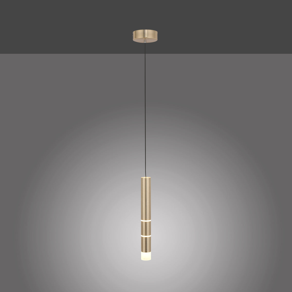Photographie du produit sur fond gris foncé avec halo lumineux diffus autour du cylindre