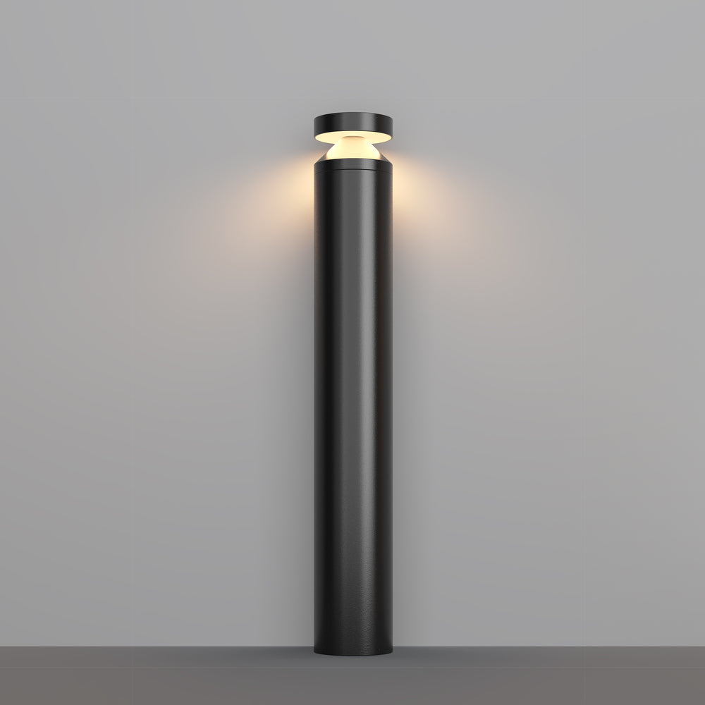 Borne lumineuse noire cylindrique de face sur fond gris clair uni
