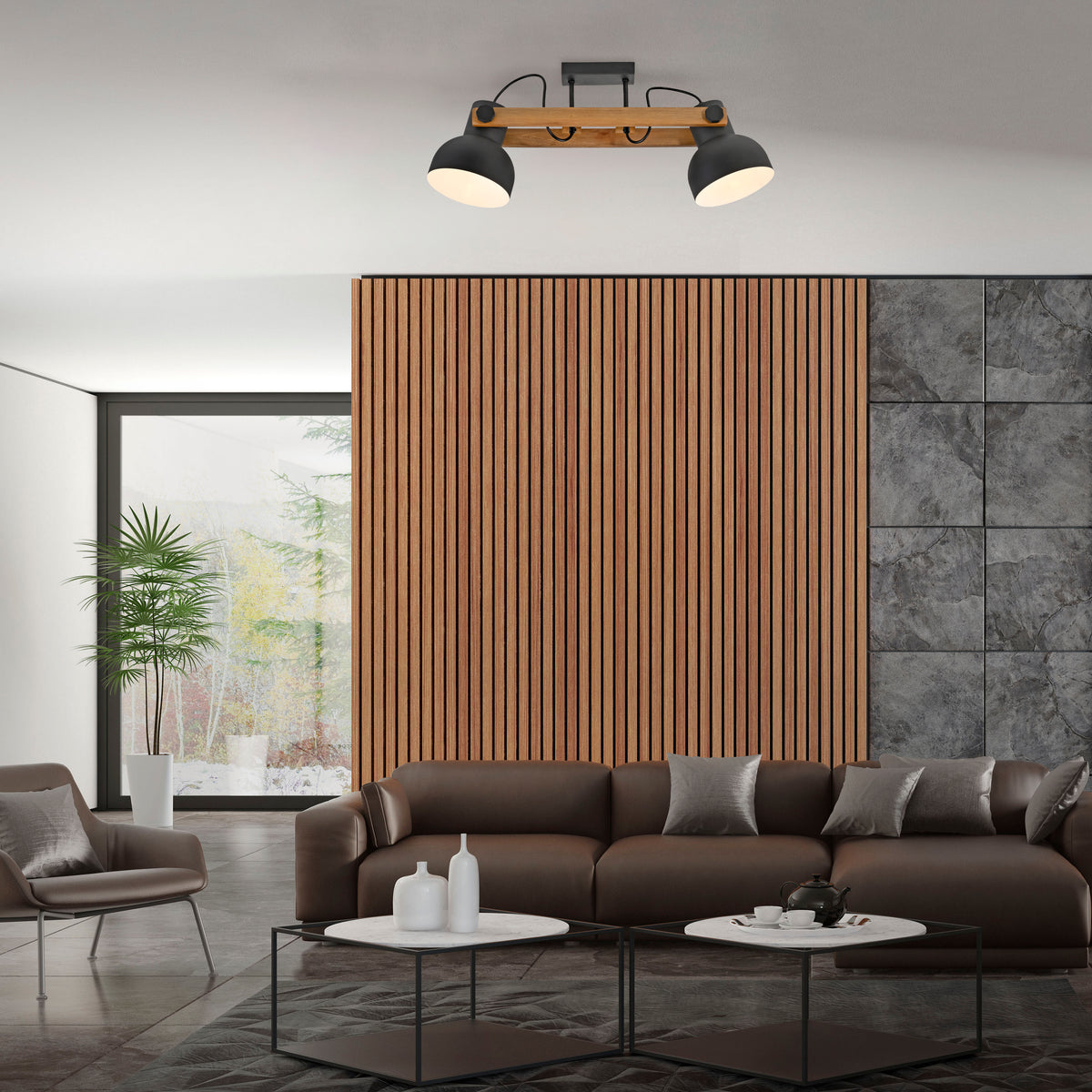 Mise en ambiance dans un salon moderne, canapé en cuir et mur lambrissé