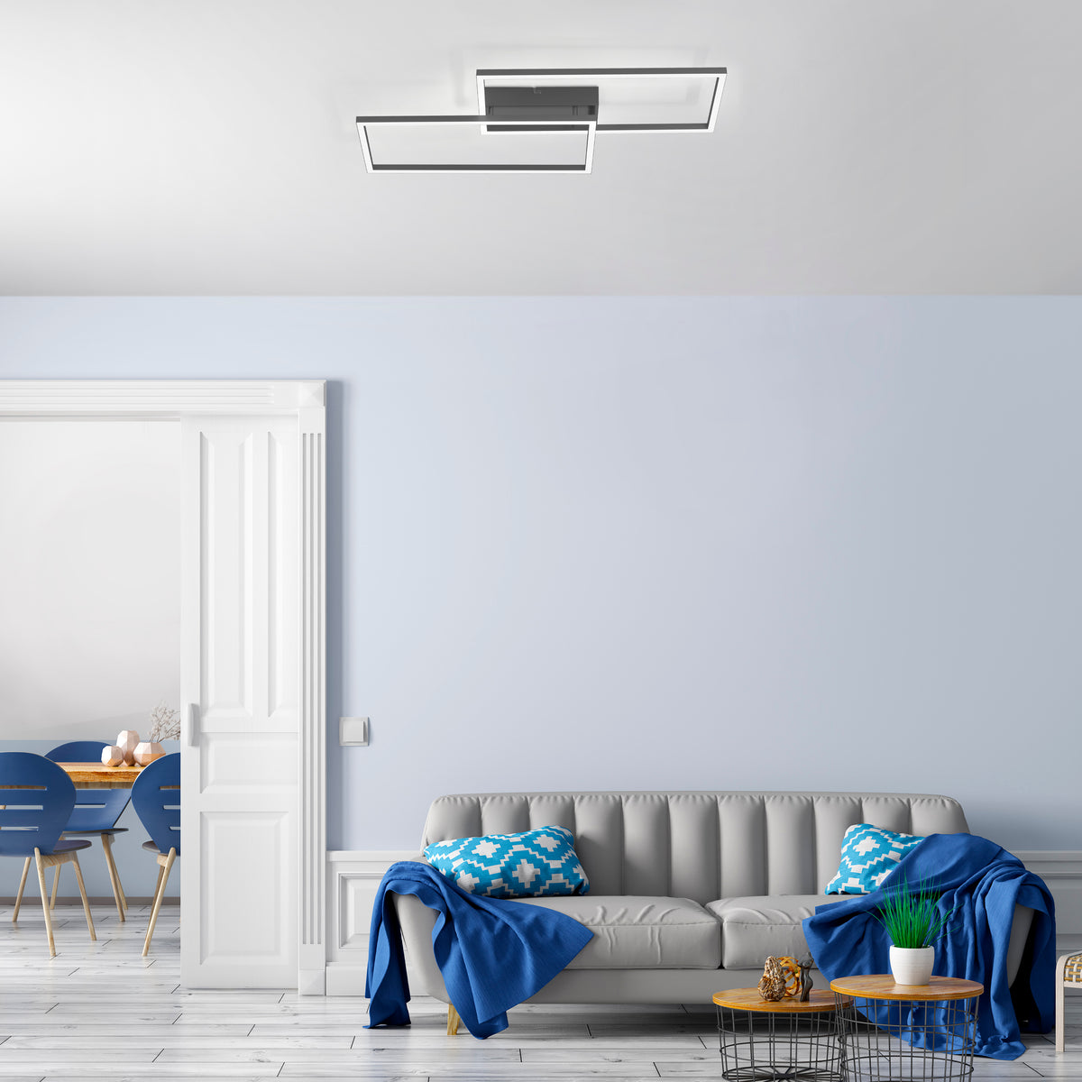Mise en ambiance du plafonnier fixé au plafond dans un salon bleu et gris.