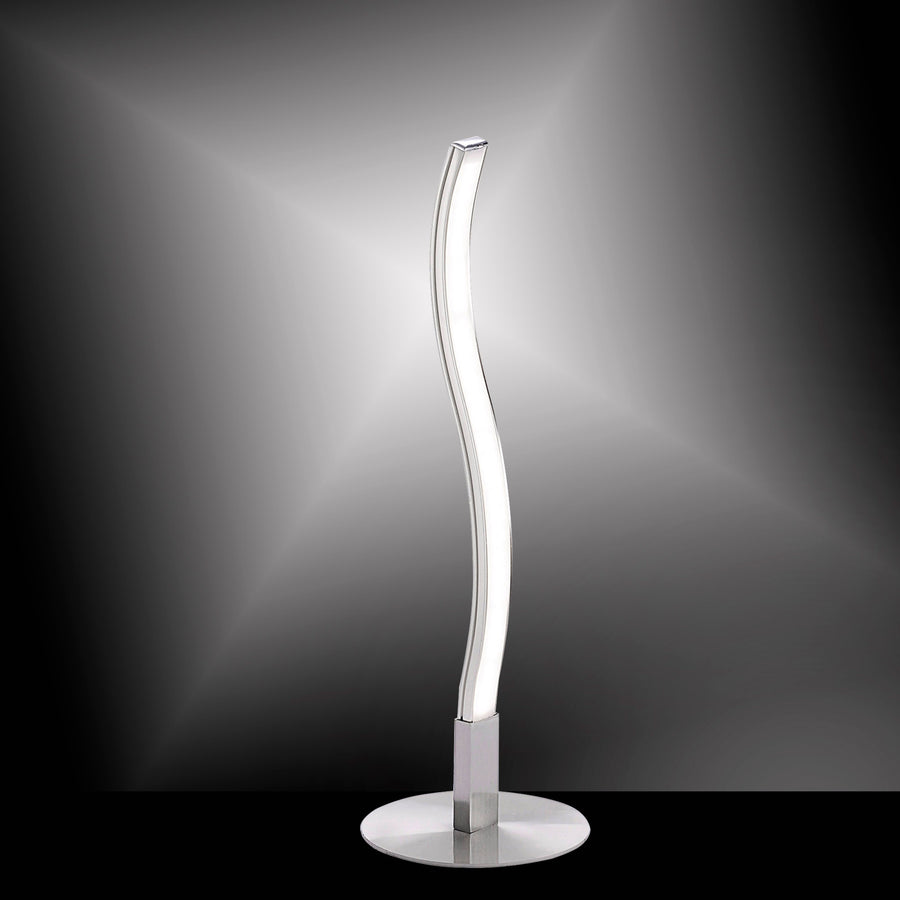Lampe à poser Wave éclairée sur fond dégradé sombre, mettant en valeur sa lumière.