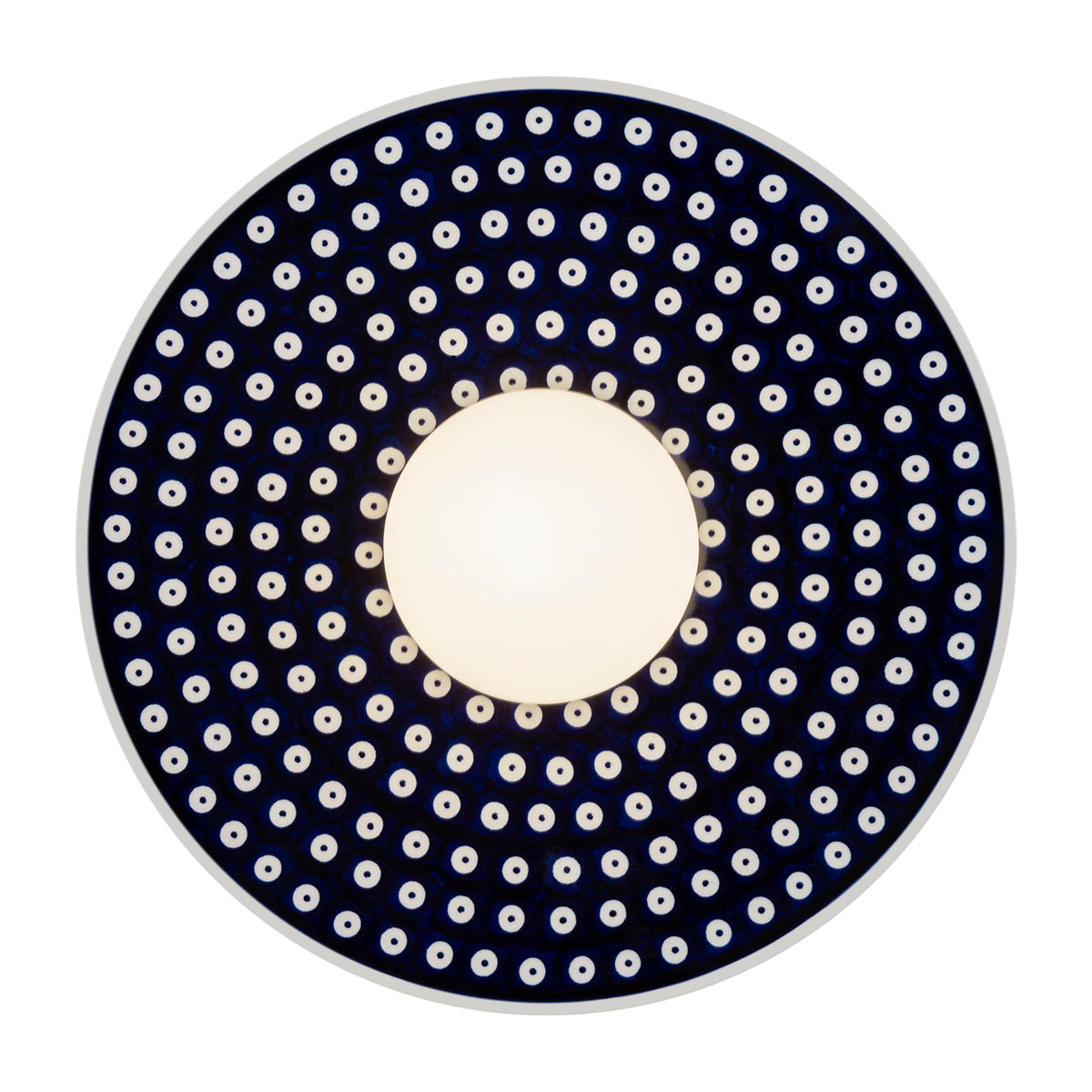 Produit de face allumé, diffuseur central ivoire et couronne pointillée bleu marine