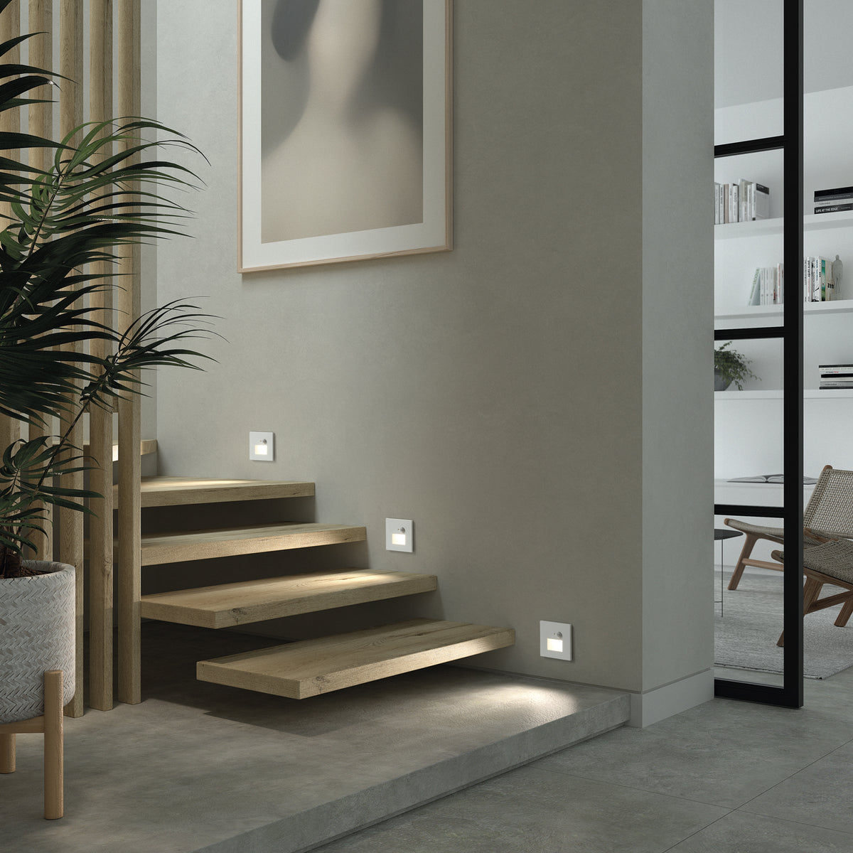 Mise en situation dans un escalier, trois spots encastrés éclairent les marches.