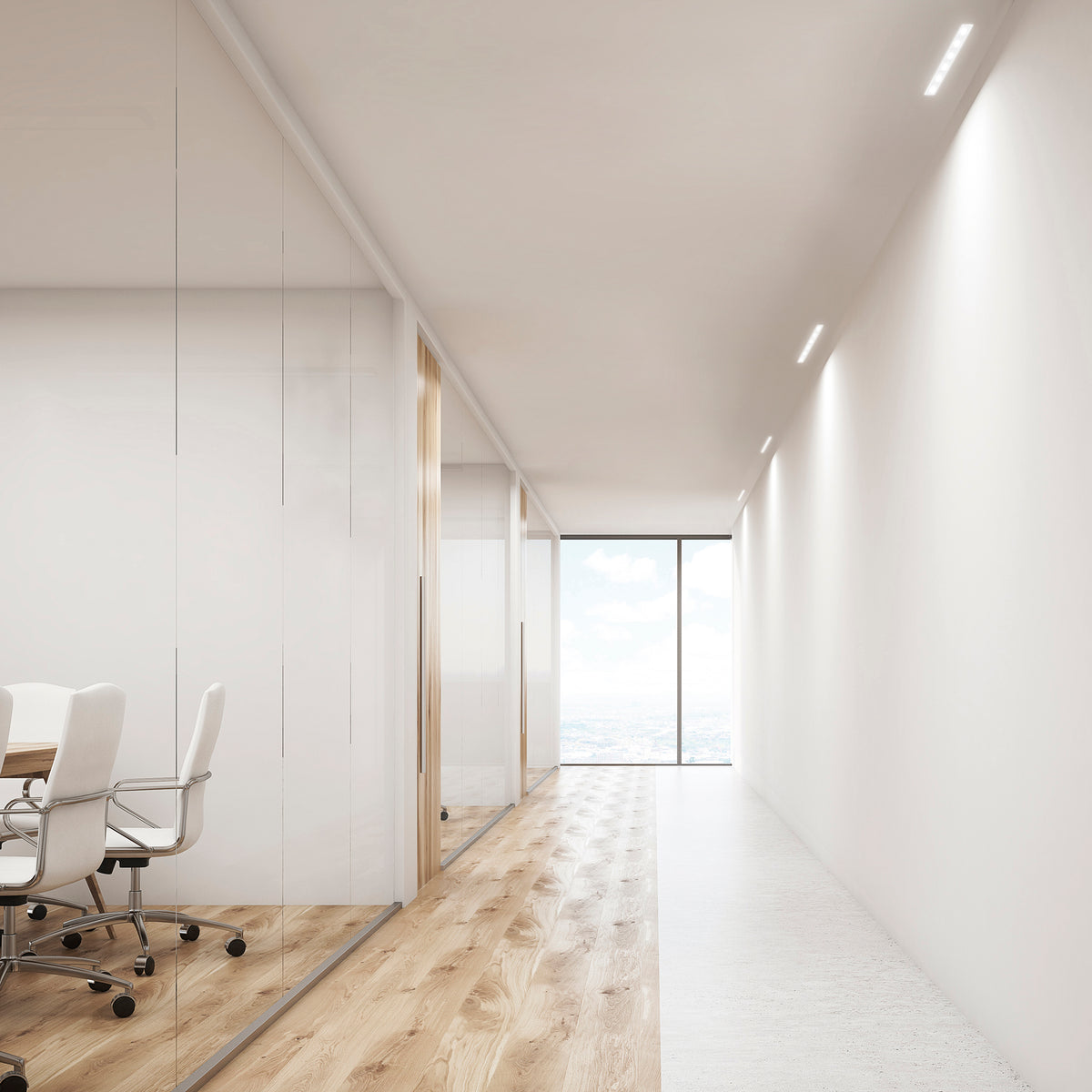 Ambiance de couloir de bureau avec plusieurs luminaires encastrés éclairant les murs.