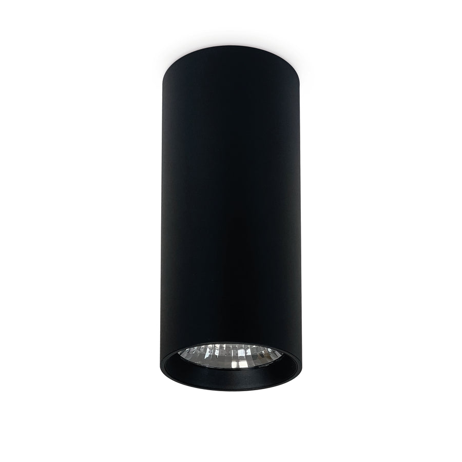 Spot cylindrique noir en saillie, collerette assortie et optique LED apparente.