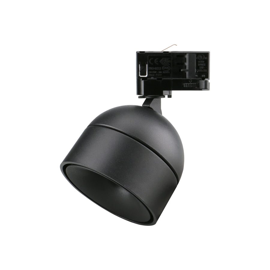 Spot noir sur rail, orientable, corps arrondi et réflecteur intérieur noir.