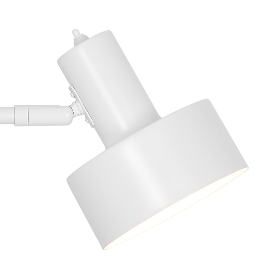 Détail rapproché de la tête cylindrique et de l'articulation réglable en blanc.