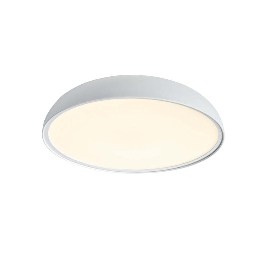 Luminaire rond blanc en perspective, bord blanc et diffuseur chaud allumé.