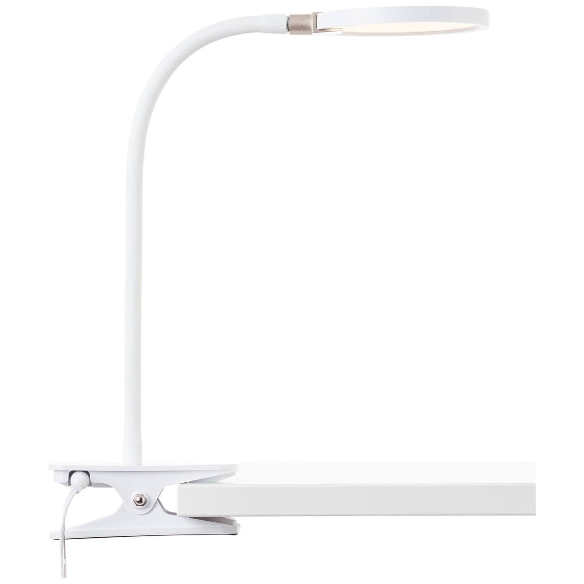 Vue de profil d'une lampe de bureau blanche à pince sur un plan de travail