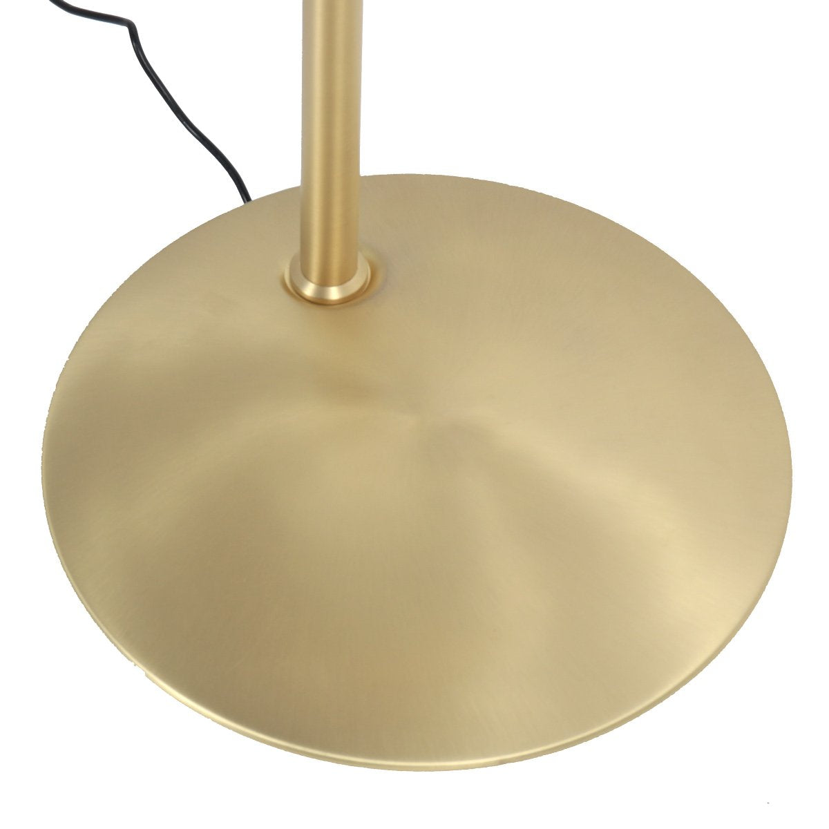 Détail de la base ronde dorée et du câble noir sortant à l'arrière.