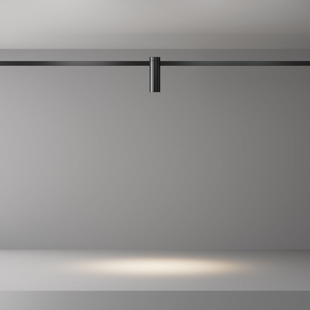 Mise en ambiance : faisceau lumineux chaud projeté sur une surface grise