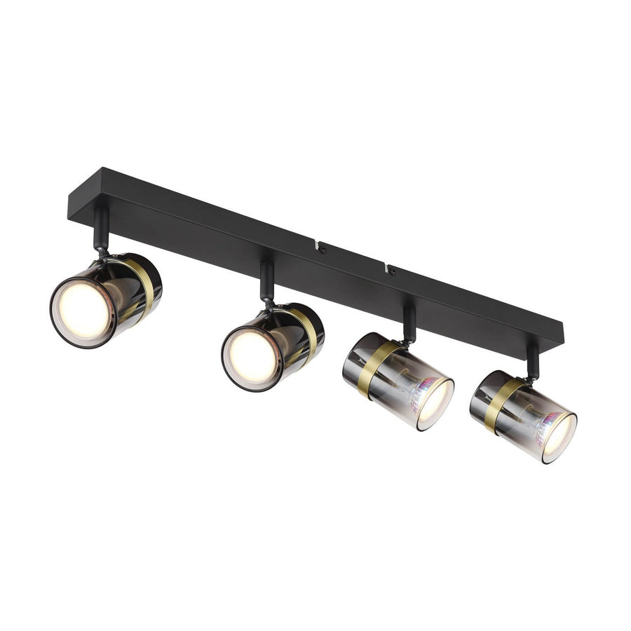 Vue de face du luminaire noir à quatre spots orientables avec anneaux dorés.