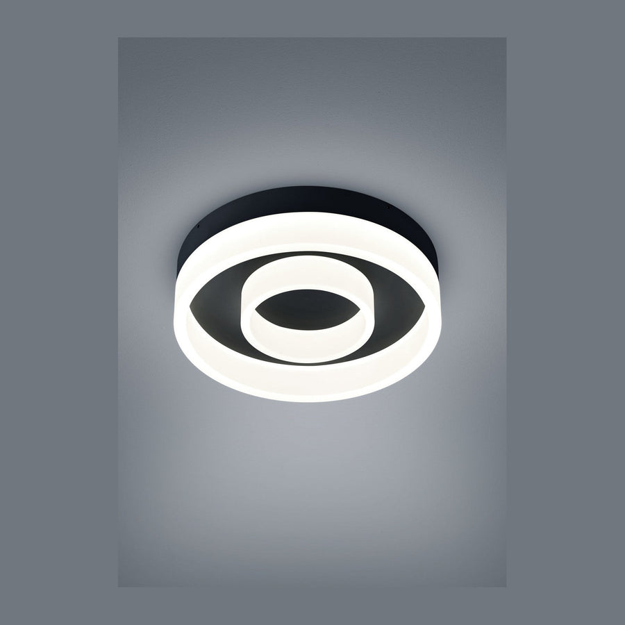Plafonnier rond noir vu de dessus, anneau lumineux LED blanc en spirale