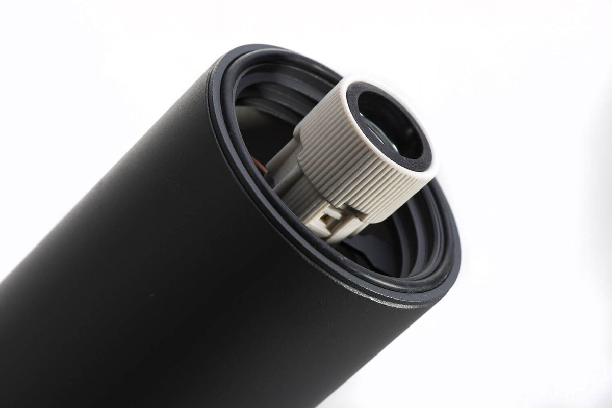 Détail de la douille et du joint d'étanchéité à l'intérieur du support cylindrique.