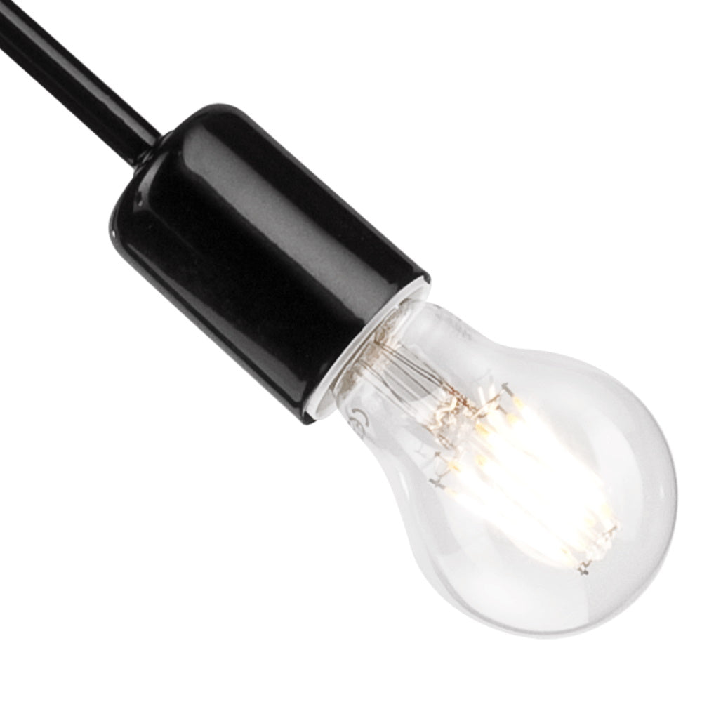 Détail d'une douille noire brillante et d'une ampoule transparente montée sur un bras.