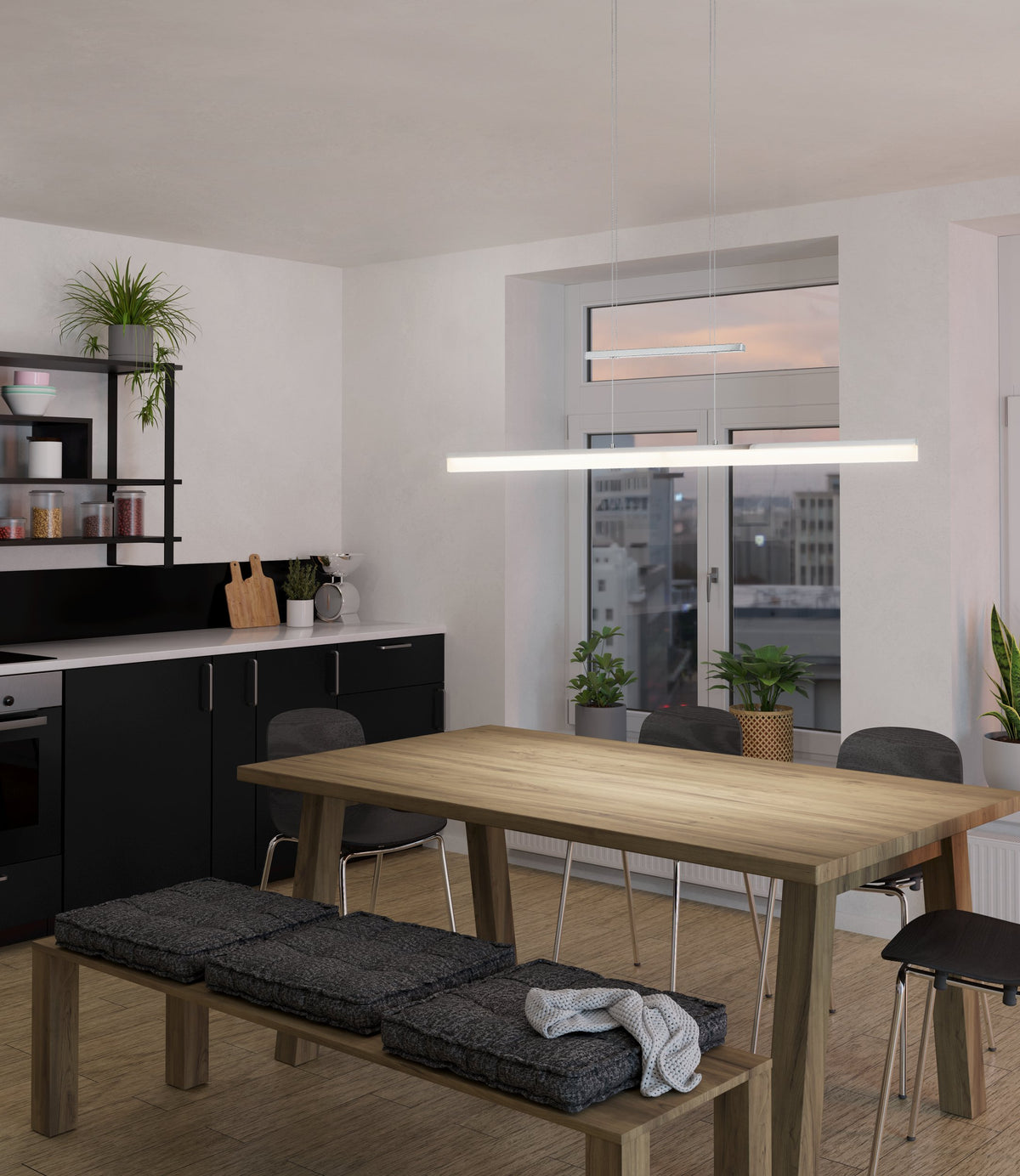 Mise en ambiance au-dessus d'une table de cuisine moderne, suspension allumée