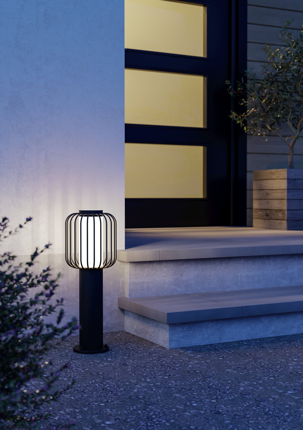 Mise en ambiance nocturne du lampadaire devant des marches et une porte vitrée