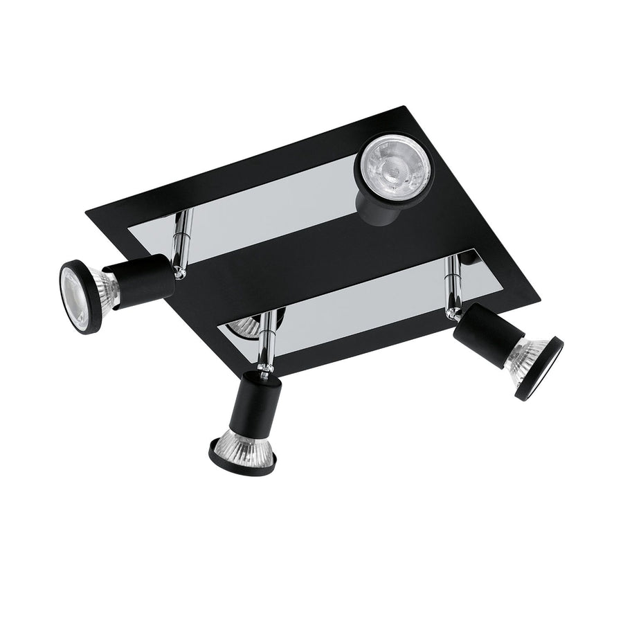 Vue de trois quarts du spot plafond noir et chromé à quatre têtes orientables.
