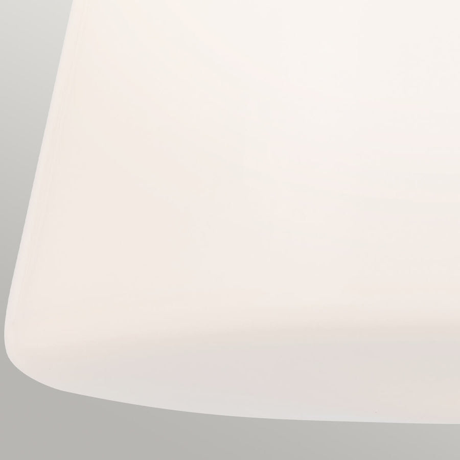 Gros plan du bas arrondi du diffuseur en verre opale blanc