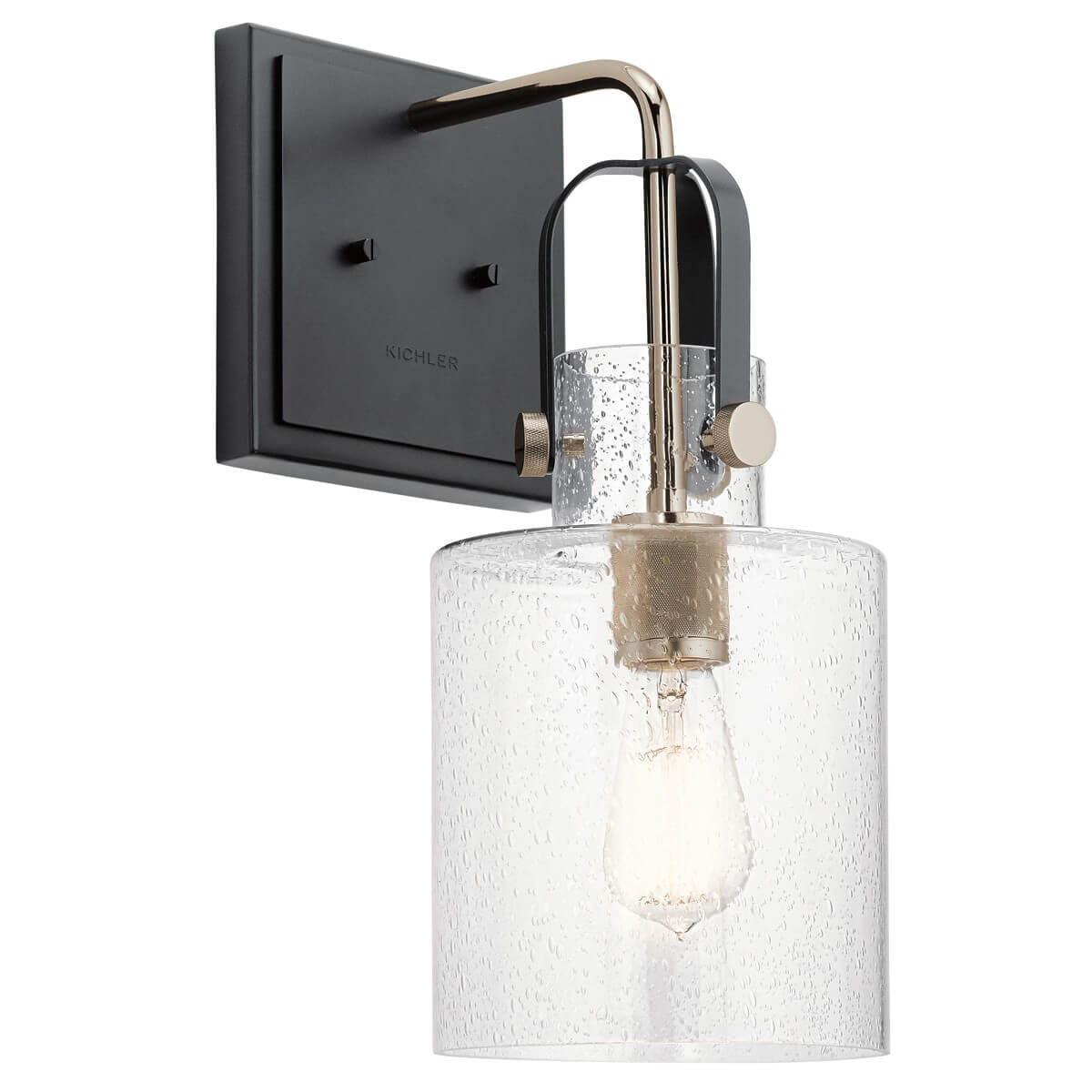 Applique murale en métal noir et nickel poli avec abat-jour cylindrique en verre texturé.