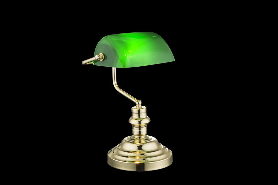 Vue de profil sur fond noir, montrant l'ampoule allumée sous l'abat-jour vert.
