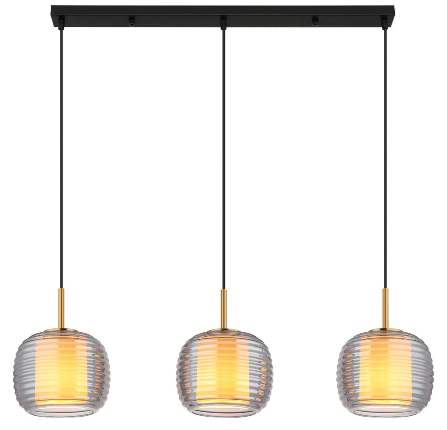 Trois globes suspendus allumés de face, lumière chaude diffusée par le verre strié