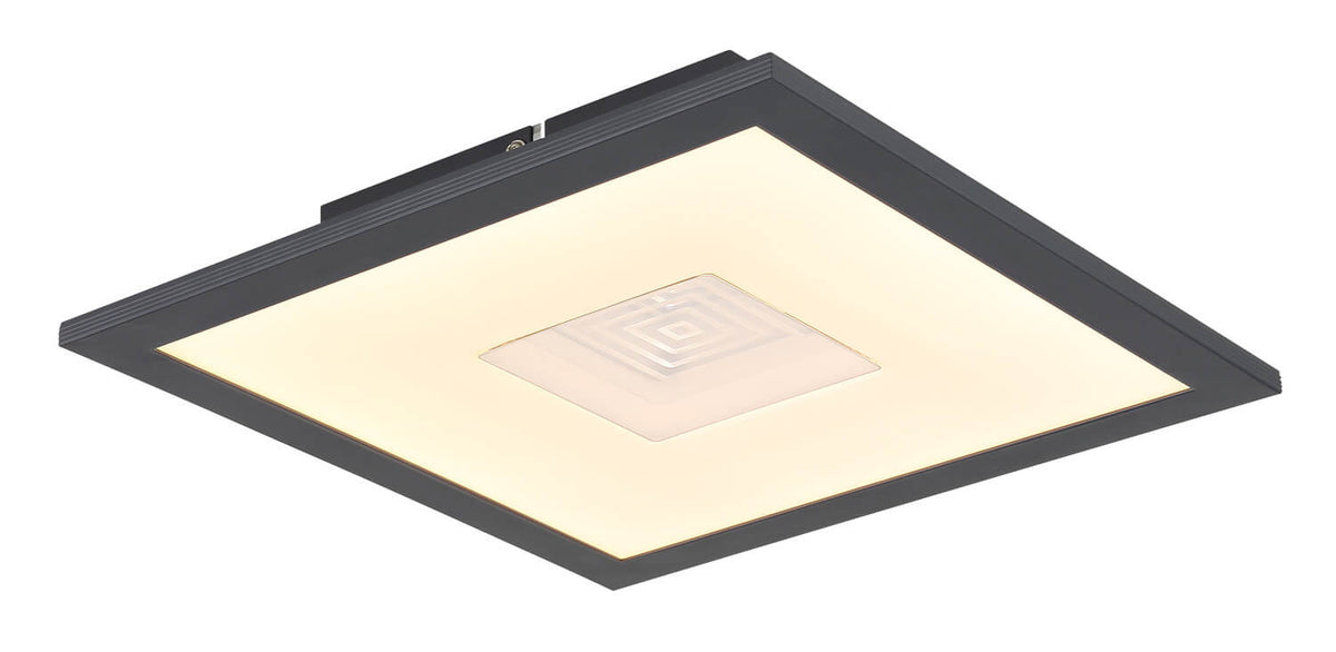 Même luminaire allumé, halo chaud diffusé par le grand diffuseur blanc opale carré