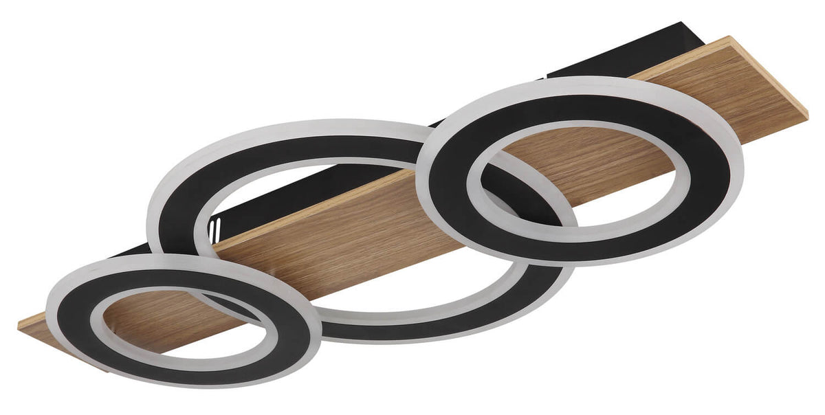 Gros plan du luminaire éteint, anneaux noirs avec diffuseur gris et base en bois.