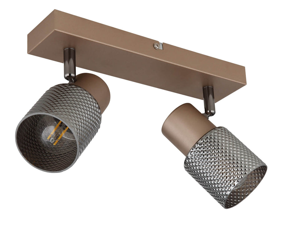 Détail de la grille métallique en losanges et de l'ampoule éclairée