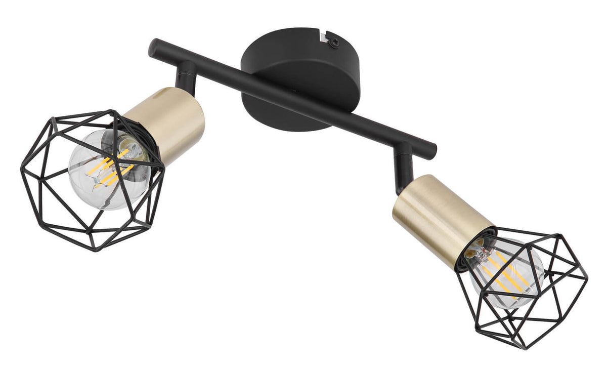 Vue rapprochée du luminaire deux spots, cages noires et douilles champagne allumées.