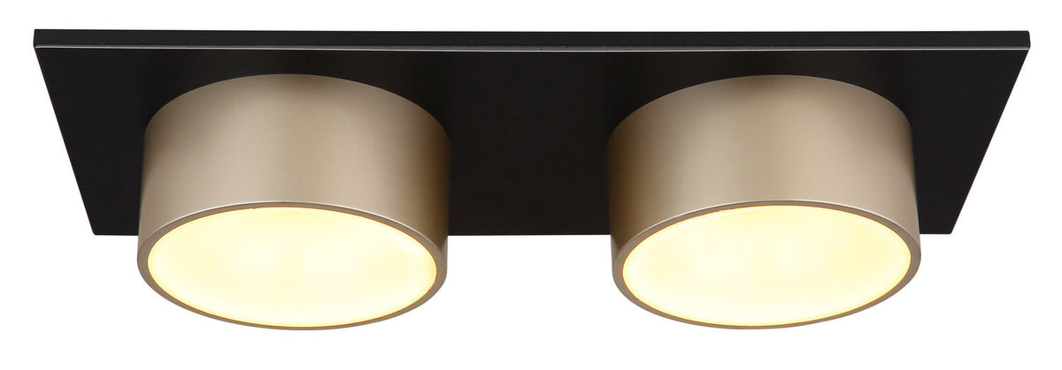 Vue de dessous du plafonnier allumé, avec ses deux diffuseurs ronds et sa base rectangulaire.