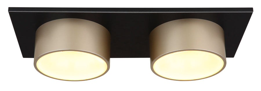 Vue de dessous du plafonnier allumé, avec ses deux diffuseurs ronds et sa base rectangulaire.