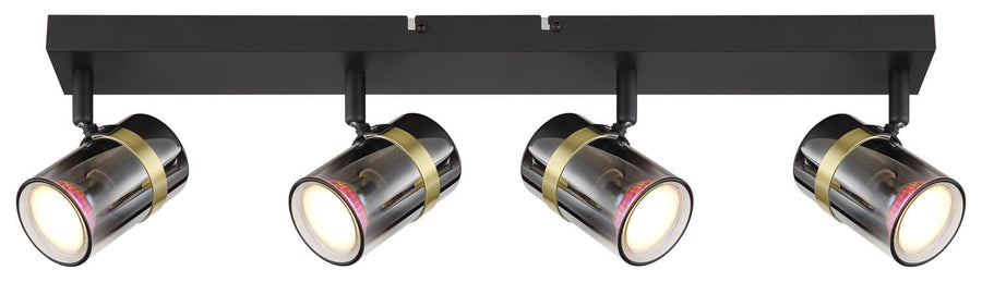 Vue frontale des quatre spots cylindriques alignés sur la barre rectangulaire noire.