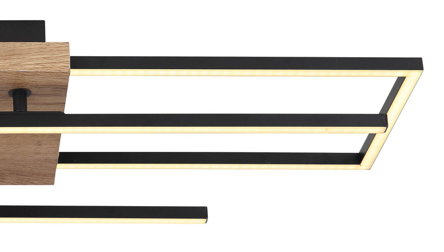 Détail rapproché d'un angle du cadre noir avec ruban LED allumé
