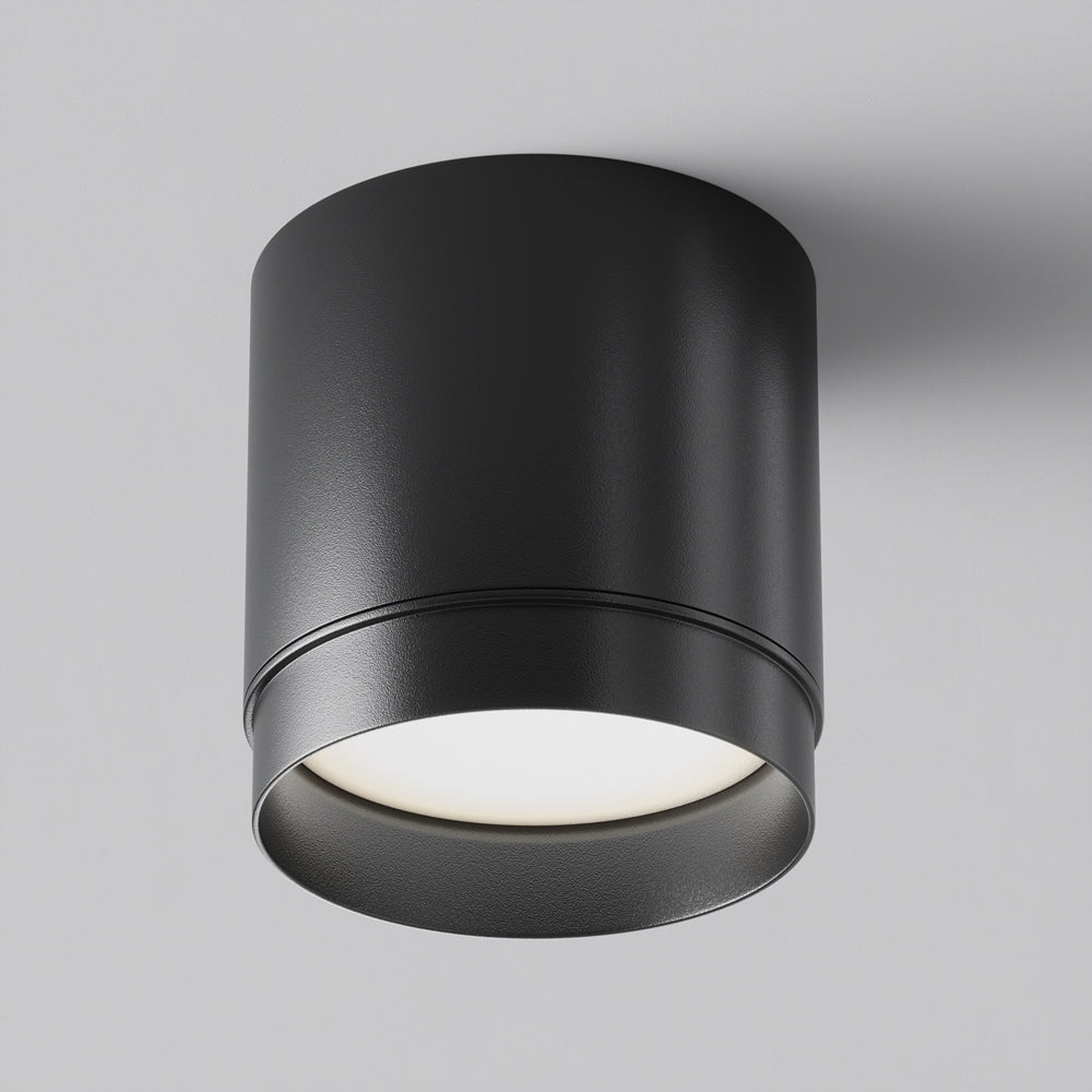 Plafonnier cylindrique noir de face, diffuseur blanc en partie basse