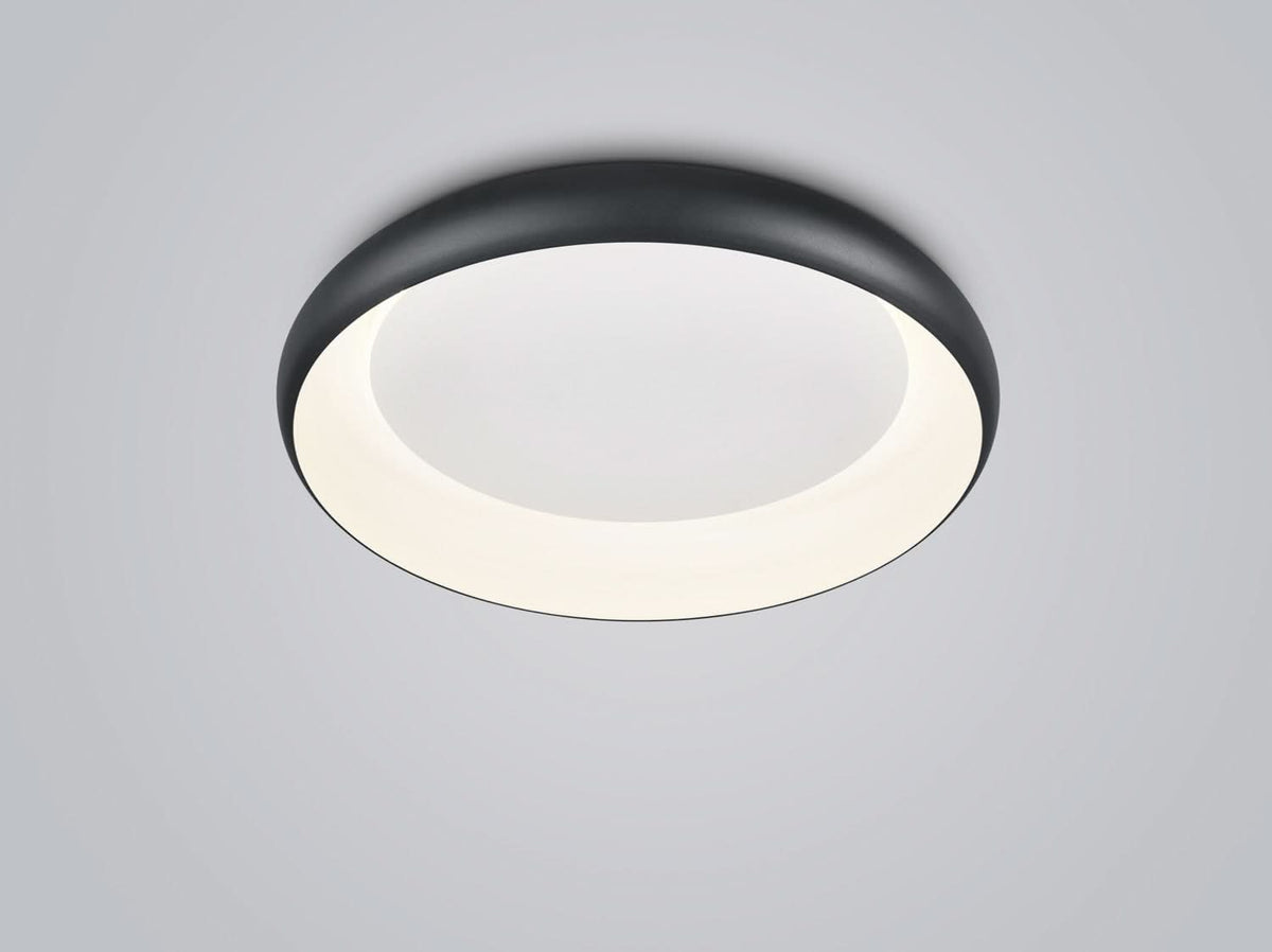 Plafonnier rond noir vu de dessous, cerclage fin et diffuseur blanc lumineux